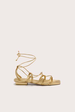 A metallic gold gladiator sandal with a slim heel.