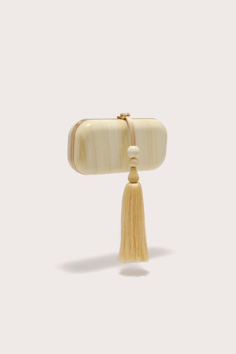 Side-facing soft, rectangular clutch crafter from marbled yellow acrylic, features a yellow beaded tassel adorning the hardware.