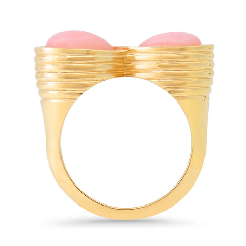 Ghost image of the side profile of an infinity ring that features two pink opals set in a reeded bezel setting.
