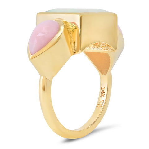 Side profile of a yellow gold trilogy ring with opal and pink opal stones.