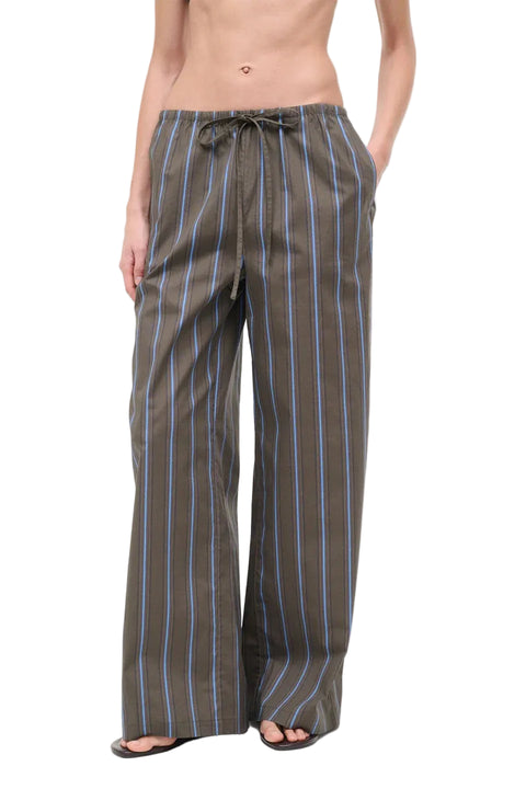 Striped pants worn by a person on a white background