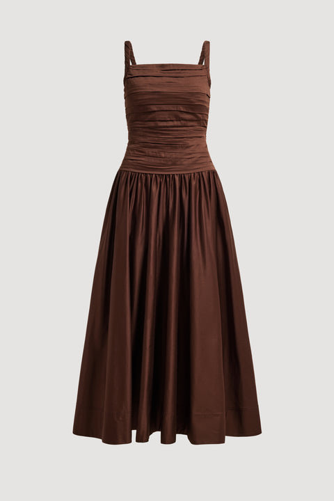 Flat lay of brown maxi dress on a light gray background