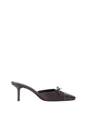 A single dark brown pointed-toe mule heel with a textured toe cap and a small bow detail, shown in profile against a plain white background.