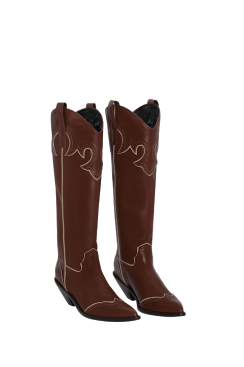 A pair of brown cowboy boots with intricate western motif embroidery