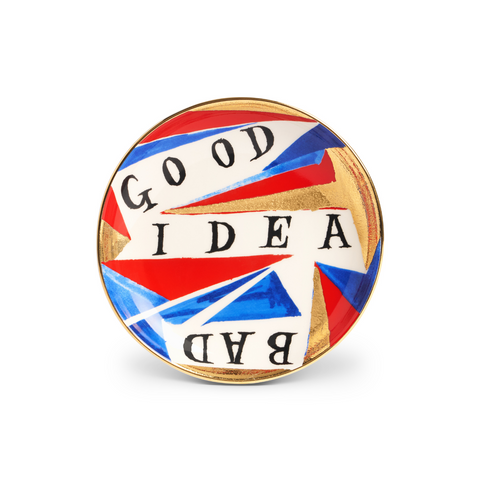 Plate with 'Good Idea Bad' in black text with red, blue white and gold geometric pattern.