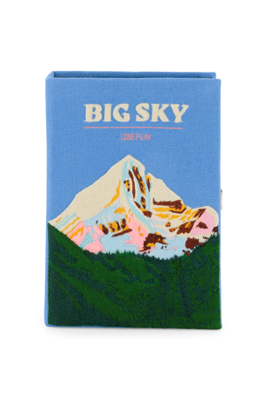 Book clutch with mountain design and 'BIG SKY' text on a blue background