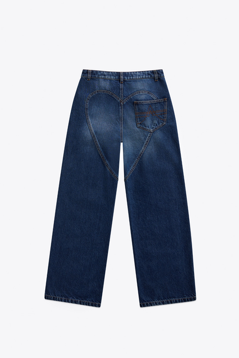 Back view of dark wash blue jeans with heart detail on a white background