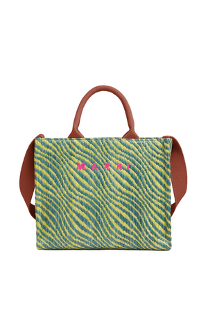 Handbag with a green and yellow striped pattern and pink text on a beige background