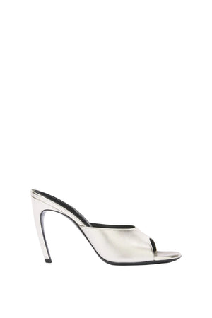 Clear high-heeled shoe with black trim on a white background