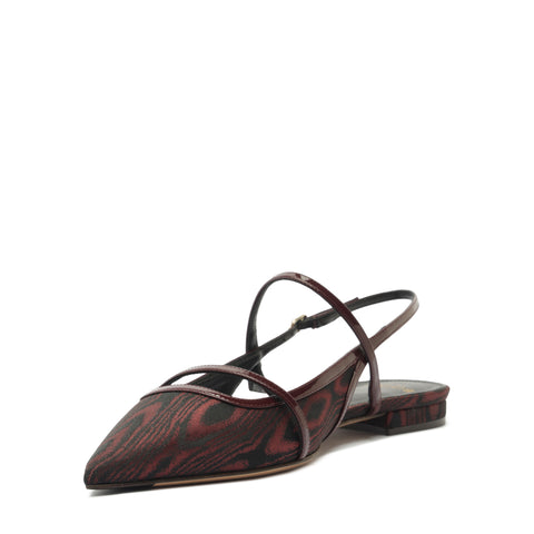 Pointed-toe sandal with brown straps on a white background