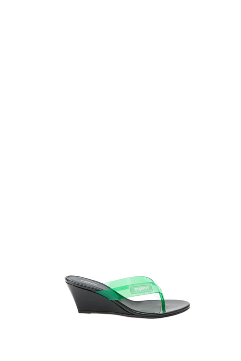 Black wedge sandal with green strap on a white background