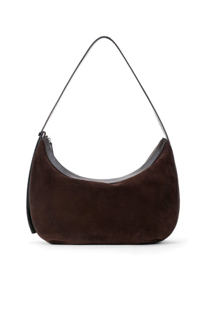 Brown suede handbag with a black strap on a white background