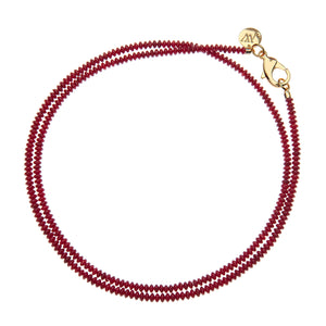 Red beaded double wrap necklace that features a large gold lobster claw clasp.