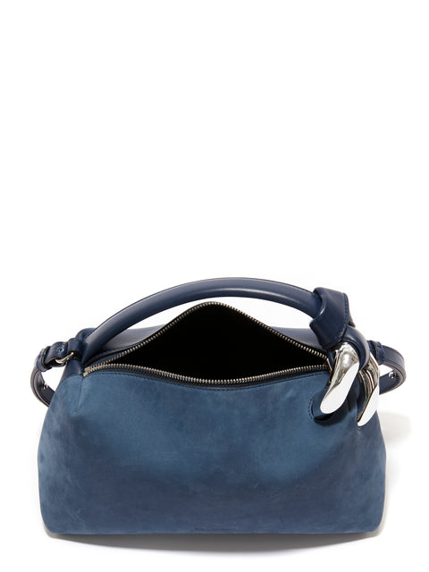 Top view look at the blue jwa bag with zipper top open.