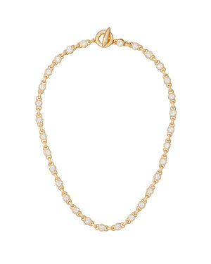 Gold chain necklace with crystal beads on a white background