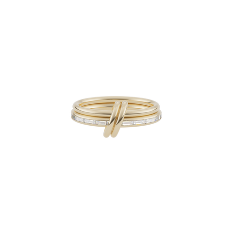Ghost image of a Spinelli Kilcollin Leora ring that features a 1.77mm 18k yellow gold band and a 2.3mm 18k yellow gold band with channel-set baguette cute white diamonds, connected by two matching 18k yellow gold connectors.