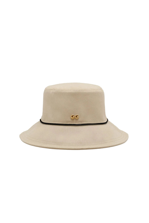 Beige bucket hat with a black band and gold accents on a white background