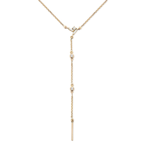 Yellow gold drop lariat necklace with diamonds.