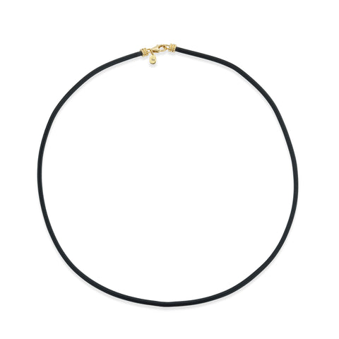 Black necklace with a gold clasp on a white background