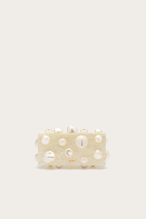 Rectangular clutch made from white marbles acrylic with abstract orbs.