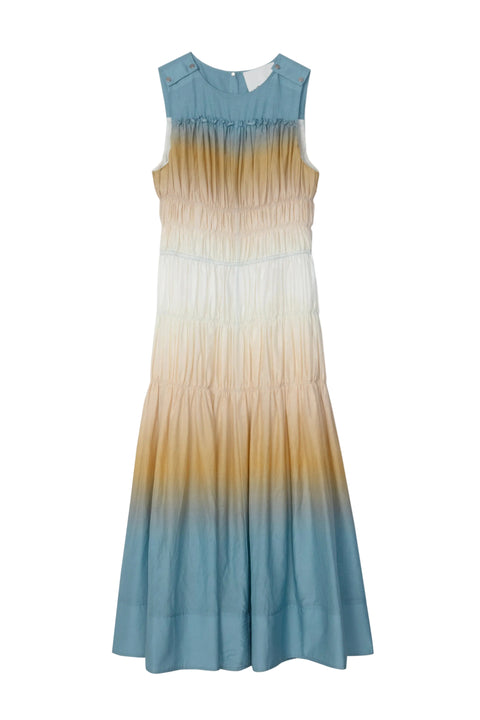 Gradient maxi dress with blue, beige, and white colors on a white background