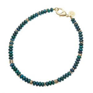 A phoenix turquoise beaded necklace with gold accent beads.