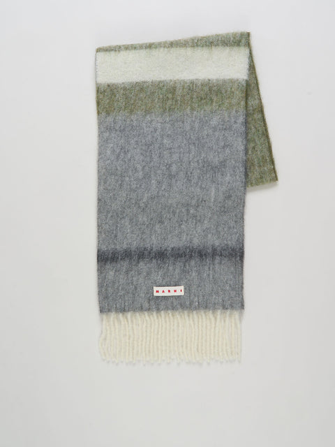 Multicolored striped scarf with a visible brand label on a light gray background