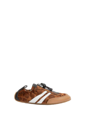 Side view of leopard print sneaker with white stripes on a white background
