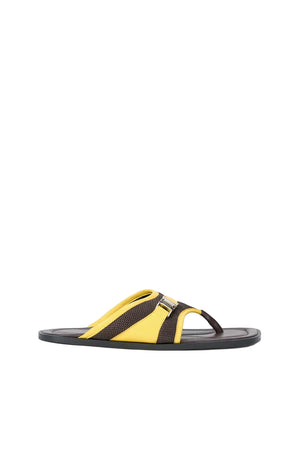 Brown and yellow flip flop sandal with buckle detail on a white background