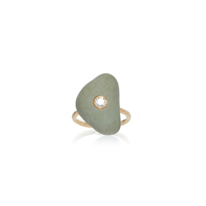 A light green triangular stone embellished with a round diamond in the center, set on a yellow gold ring band.