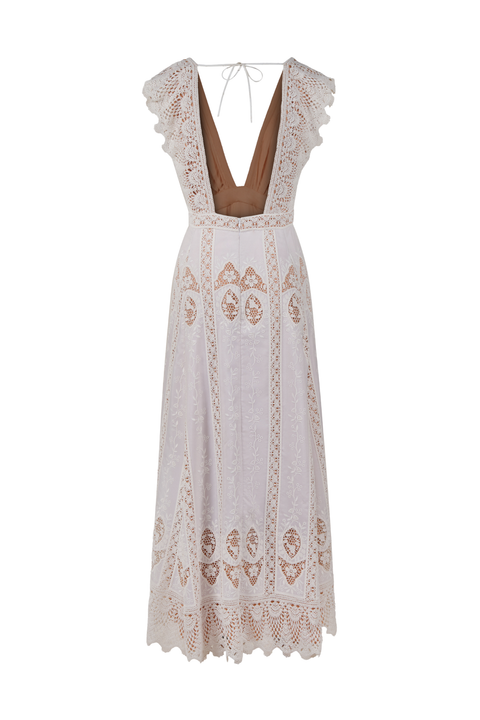 A white embroidered voile ankle dress with a deep v neckline and tie back