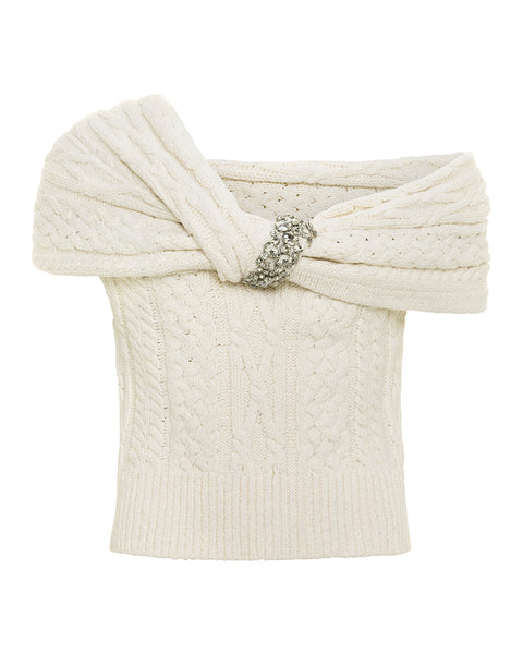 White cable knit top with a decorative crystal embellishment on a white background