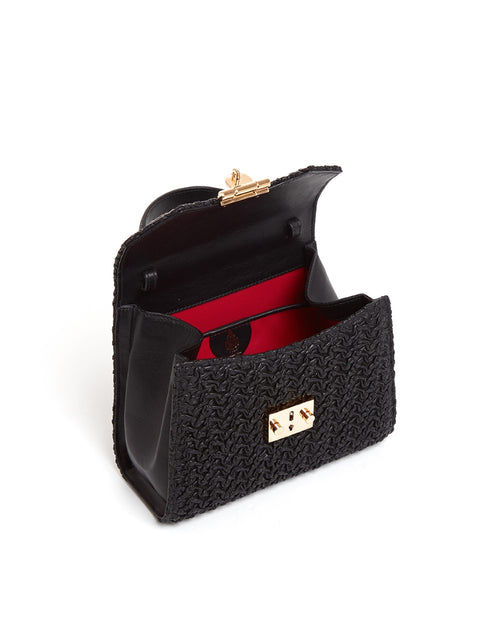 The black bag opened to show the red inner lining