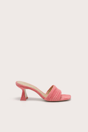 Side profile of a square toe kitten heel that is crafted from pink plisse fabric. 