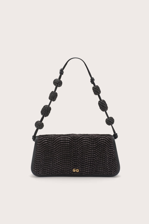 A black wavy raffia shoulder bag with raffia beads on the shoulder strap. 
