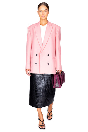 Model facing the camera in the pink oversized blazer