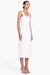 Model turned towards the right in the white lace up bodice midi dress