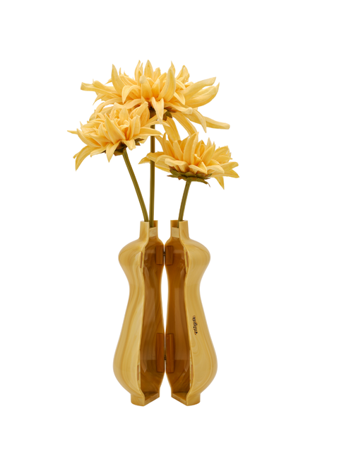 Opened yellow marbled vase clutch with yellow flowers.