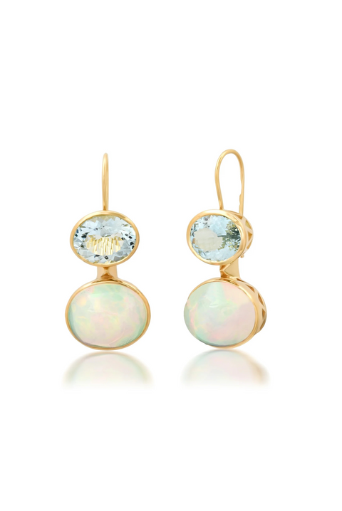 Ghost image of a pair of earrings that features an oval aquamarine stone of a slightly larger oval opal, set in yellow gold/ 
