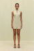 Woman wearing a khaki high-neck mini dress that features a utility design, front zipper, and sleek side pockets, paired with black sandals.  