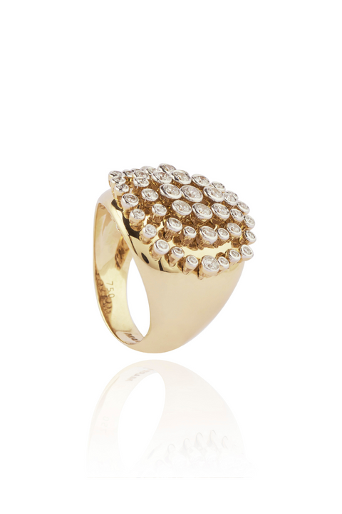 Gold ring with diamond accents on a white background