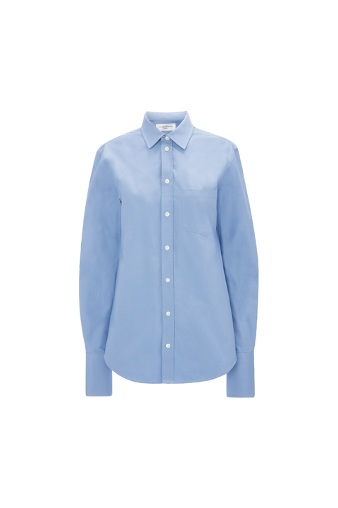 A light blue waist-length button down with white buttons on a white background