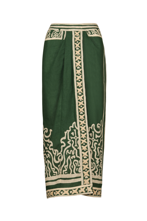 A dark green wrap-style midi skirt with ornate beige and cream geometric and scroll-like border patterns, shown against a plain white background.