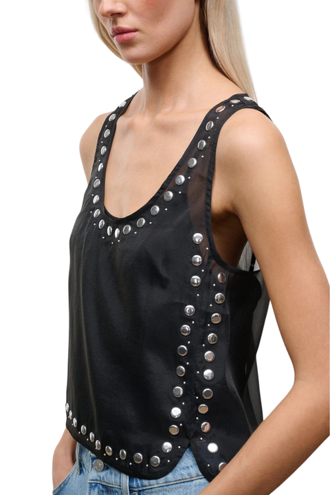 A woman wearing a black sheer organza sleeveless top with stud embellishments close up