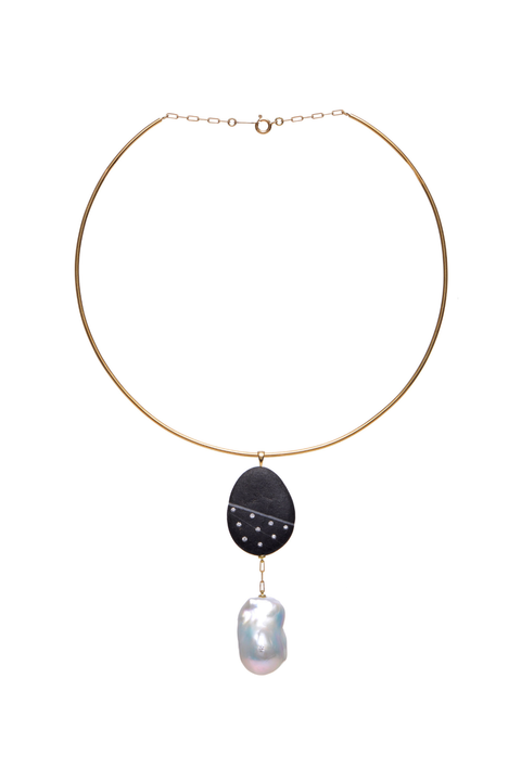 Necklace with a black pendant and pearl drop on a white background