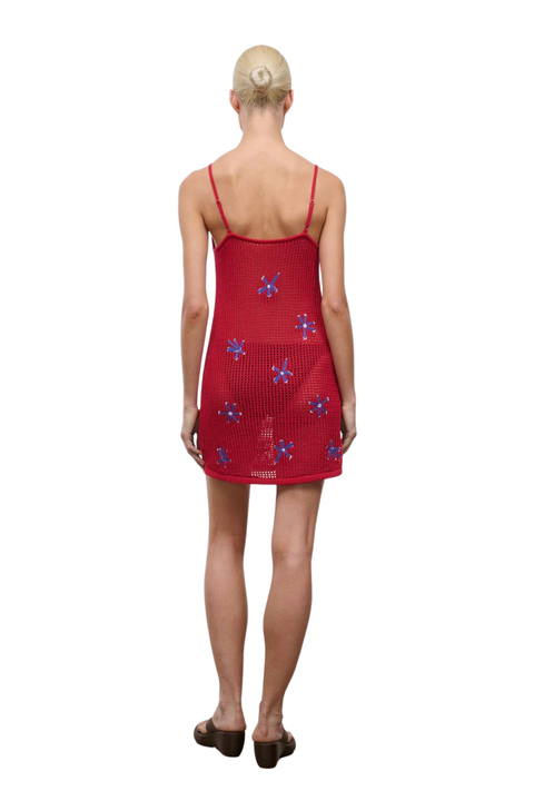 Red dress with floral patterns on a white background back angle