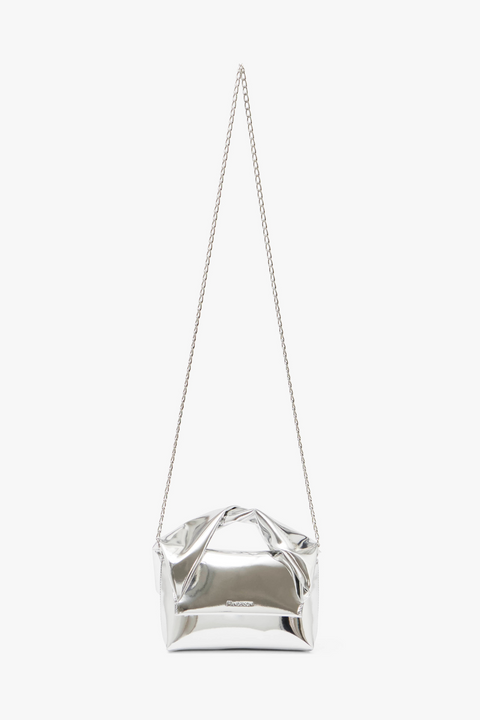 Small silver handbag with top handle and silver chain body strap.