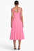 Model facing the back in the pink sleeveless midi dress