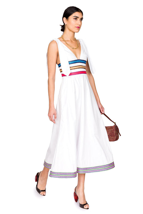 Model walks in v-neck cotton midi dress.