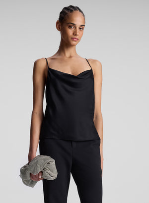 Women styled wearing black satin camisole top.